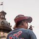 A man watches the sun rise on the Confederate battle flag at the South Carolina Statehouse on July 10, 2015, in Columbia.